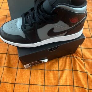 Jordan Black and Gray Sneakers with Red Accent